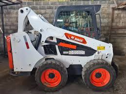 MANUAL DE OPERAÇÃO E MANUTENÇÃO MINI CARREGADEIRA S570 BOBCAT